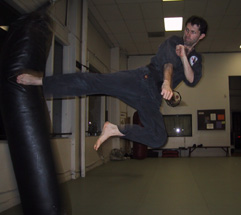 Marc Stewart kicks Heavy Bag